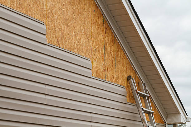 Professional Storm Damage Siding Repair technician working in Roaring Spring, PA